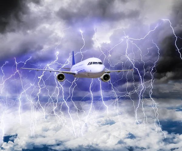 The plane flies through a storm with lots of lightning — Stock Photo, Image