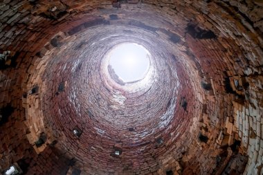 View from inside the old brick industrial pipes clipart