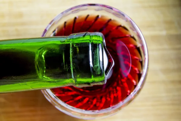 Wine is poured into a glass, top view — Stock Photo, Image