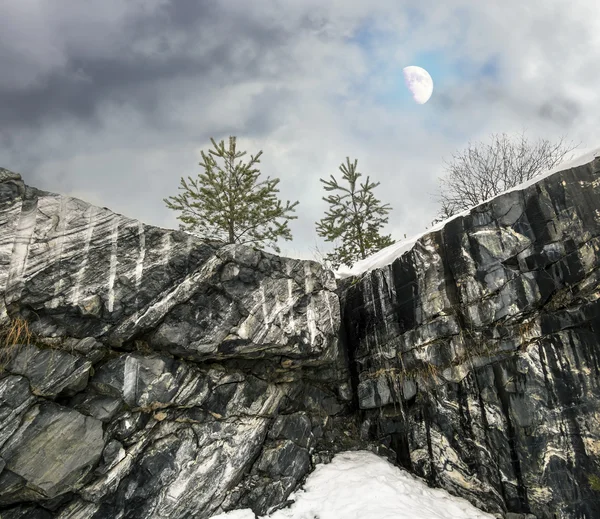 Harsh northern Misty landscape with moon. Ruskeala marble quarri — Stock Photo, Image