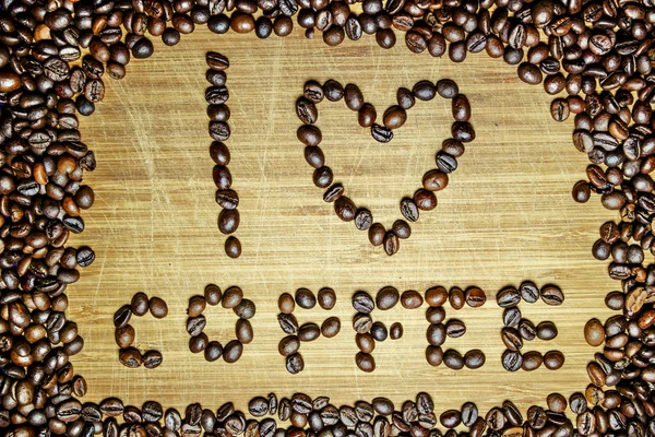 Nápis "Miluji kávu", získané z kávových zrn — Stock fotografie