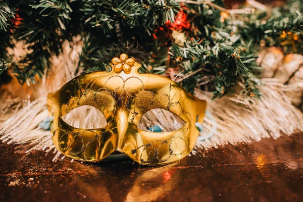 Christmas. Carnival mask near the Christmas tree. mask near new year tree.