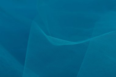 Arkaplan olarak kullanılan açık mavi doku. Mavi açık renk kumaş dokusu. Yakın çekim mavi sentetik kürk dokusu