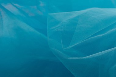 Arkaplan olarak kullanılan açık mavi doku. Mavi açık renk kumaş dokusu. Yakın çekim mavi sentetik kürk dokusu