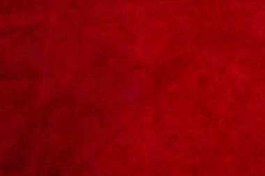 Pürüzsüz deri kadife desenli. Keçeleşmiş makro. Kırmızı süet kumaş. Kumaş, deri
