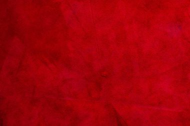 Pürüzsüz deri kadife desenli. Keçeleşmiş makro. Kırmızı süet kumaş. Kumaş, deri