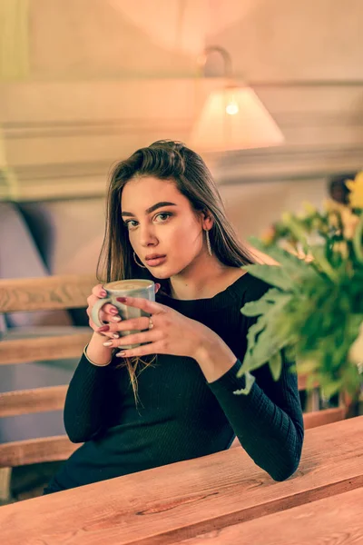 Beautiful Woman With Cup of Tea or Coffee.