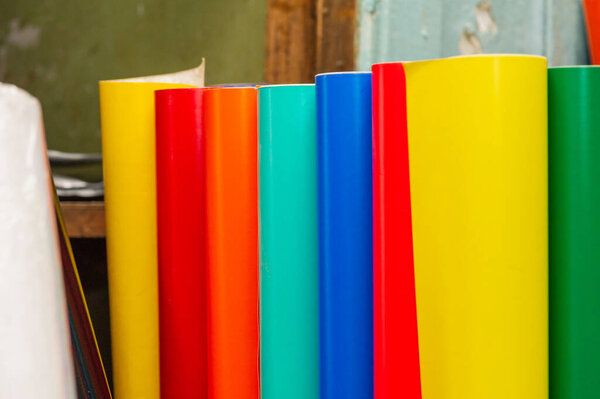 colored vinyl car wrapping or plotter cutting sticker foil film rolls. Film in rolls for advertising