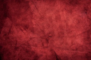 Pürüzsüz deri kadife desenli. Keçeleşmiş makro. Kırmızı süet kumaş. Kumaş, deri