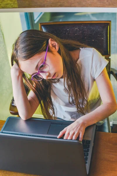 Teenage girl at the computer home teaching. computer, distant learn, research, webinar, class lesson