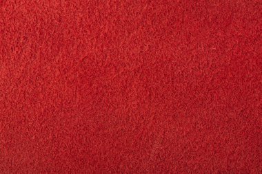 Red suede for the background. Texture of natural red suede.