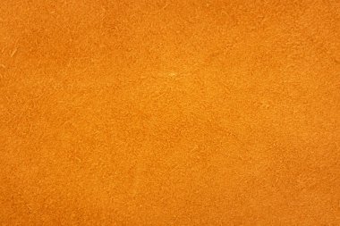 Suede. Background of yellow. The texture of the skin is natural.