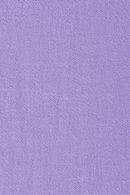 Arka plan olarak mor kumaş desenli makro fotoğraf