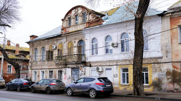 Astrakhan, Russia, January 10, 2021. Old buildings of the city. Facade. Red embankment street.