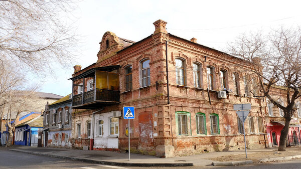 Astrakhan, Russia, January 10, 2021. Old buildings of the city. Facade. Embankment 1 May street.