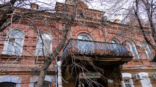 Astrakhan, Russia, January 9, 2021. Old buildings of the city. Facade. Chekhov street