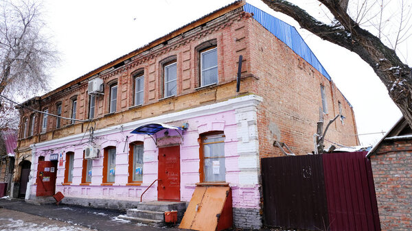 Astrakhan, Russia, January 12, 2021. Old buildings of the city. Facade. Saint-Simon street