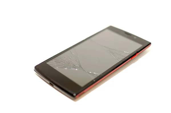 Telefone celular preto com tela quebrada. conceito de reparação de equipamentos eletrônicos. crack em vidro smarton — Fotografia de Stock