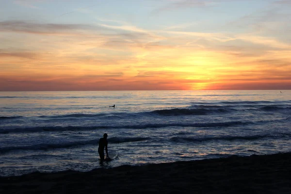 Surfing in corona times at Forte dei Marmi, Tuscany, Italy