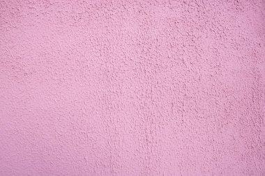 Pembe dekoratif rahatlama. Pembe sıva duvar. Duvarın pembe arkaplanı.