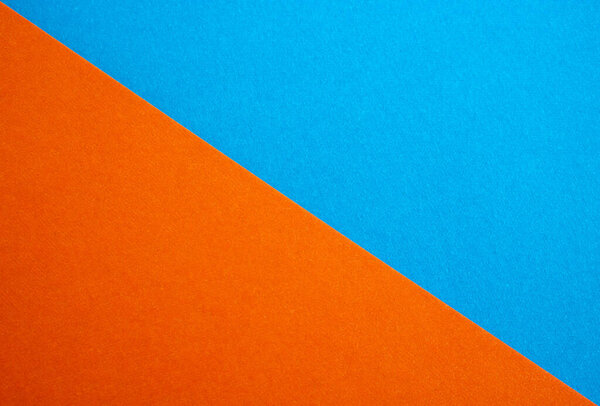 Close up of a blue suede and orange divided by half the ratio of the textured background,the separation of tissues.
