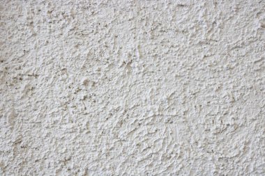 Alçılı duvarın soyut beyaz arkaplanı.
