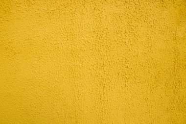 Kalıplı sarı arka plan. Dekoratif alçı duvarlar, dış cephe dekorasyonu..