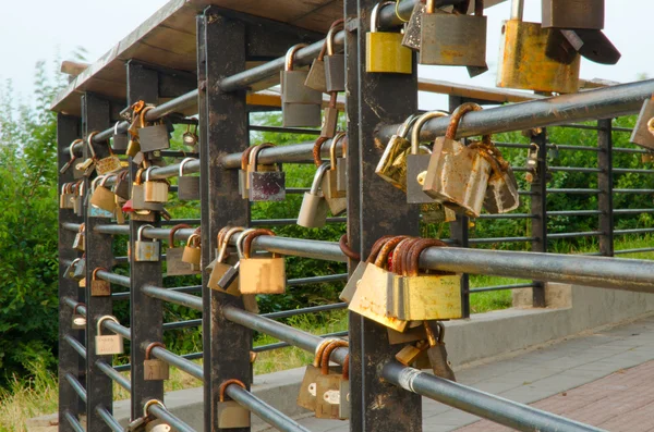 Lock in heart shape on the railing of bridge — Stock Photo, Image