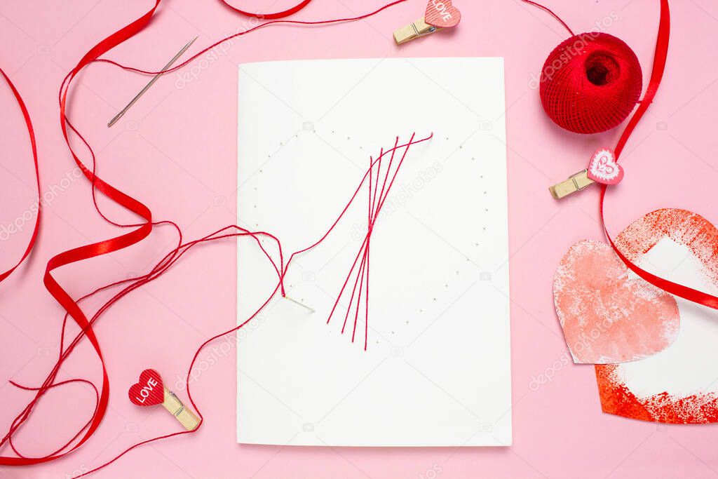 step 5 DIY red thread card on white cardboard, concept of valentines day, mothers day