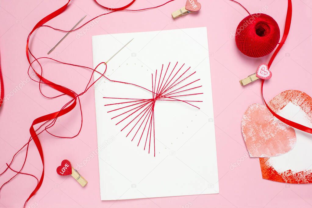 step 6 DIY red thread card on white cardboard, concept of valentines day, mothers day