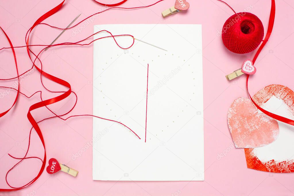 step 4 DIY red thread card on white cardboard, concept of valentines day, mothers day