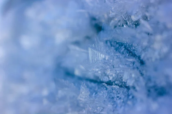 Snow crystals close-up, frozen blue wall — Stock Photo, Image