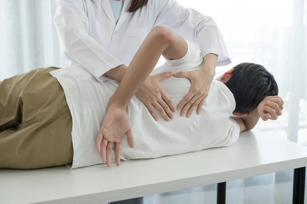 Female Physiotherapists Provide Physical Assistance Male Patients Back Injuries Back — Stock Photo, Image