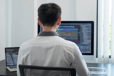 Programmer, Man working with computer programming, professional development, and coding technology, working on high-quality visual software development websites.