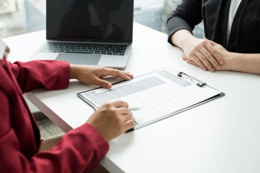 Business people hold a resume and talk to work applicants for work interviews about careers and Their personal history in the company. Recruitment concepts.