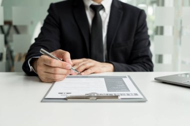 Business people hold a resume and talk to work applicants for work interviews about careers and Their personal history in the company. Recruitment concepts.