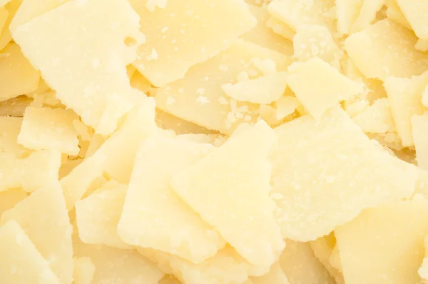 Background of parmesan flakes — Stock Photo, Image