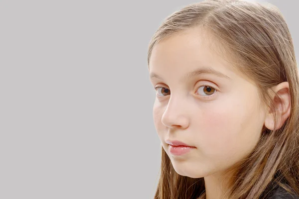 Portrait of pre teenage girl isolated on  grey background — Stock Photo, Image