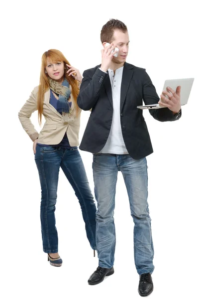 Two business people working with a laptop and phone — Stock Photo, Image