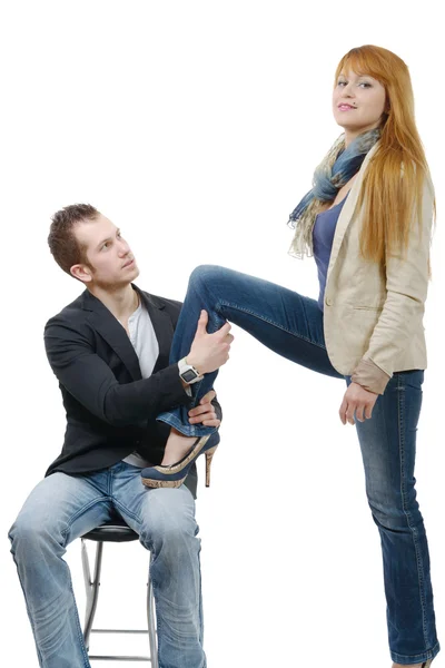 Young woman sets foot on her lover — Stock Photo, Image