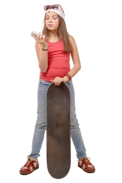 Fashion pretty little girl with skateboard, isolated on white — Stock Photo, Image