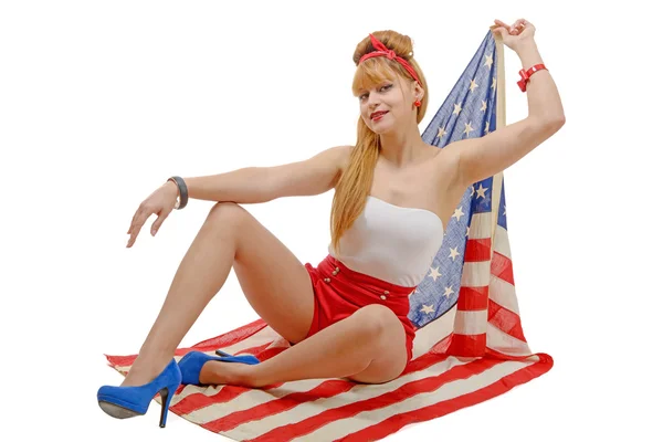 Sexy pin up chica sosteniendo una bandera americana . — Foto de Stock