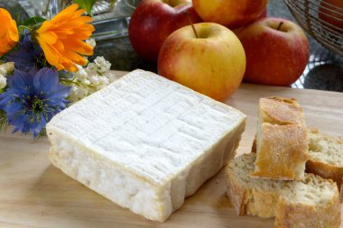 tray with pont eveque cheese with bread and apples clipart