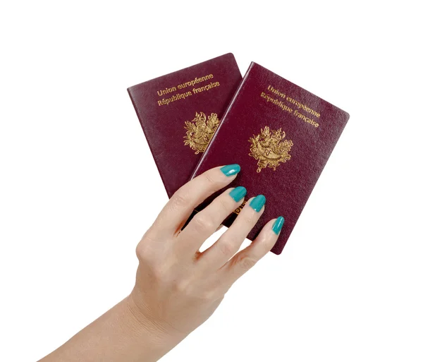 Mão mulher com dois passaporte francês isolado no branco — Fotografia de Stock