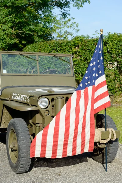 Ww2 military vehicle with American flag Stock Photo