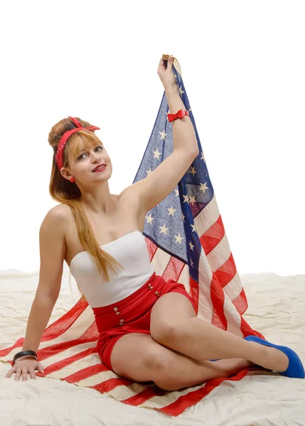 Sexy pin up ragazza con una bandiera americana Immagini Stock Royalty Free