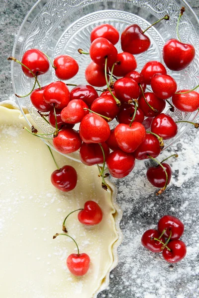 Fresh cherries and pie dough — Stock Photo, Image