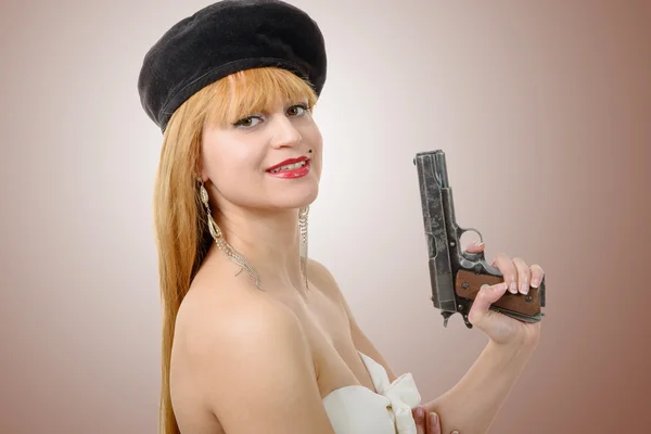 Pretty young sexy woman with gun — Stock Photo, Image