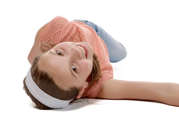 Young girl lying on the floor — Stock Photo, Image