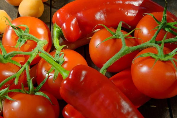 Tomatoes and red peppers — Stock Photo, Image